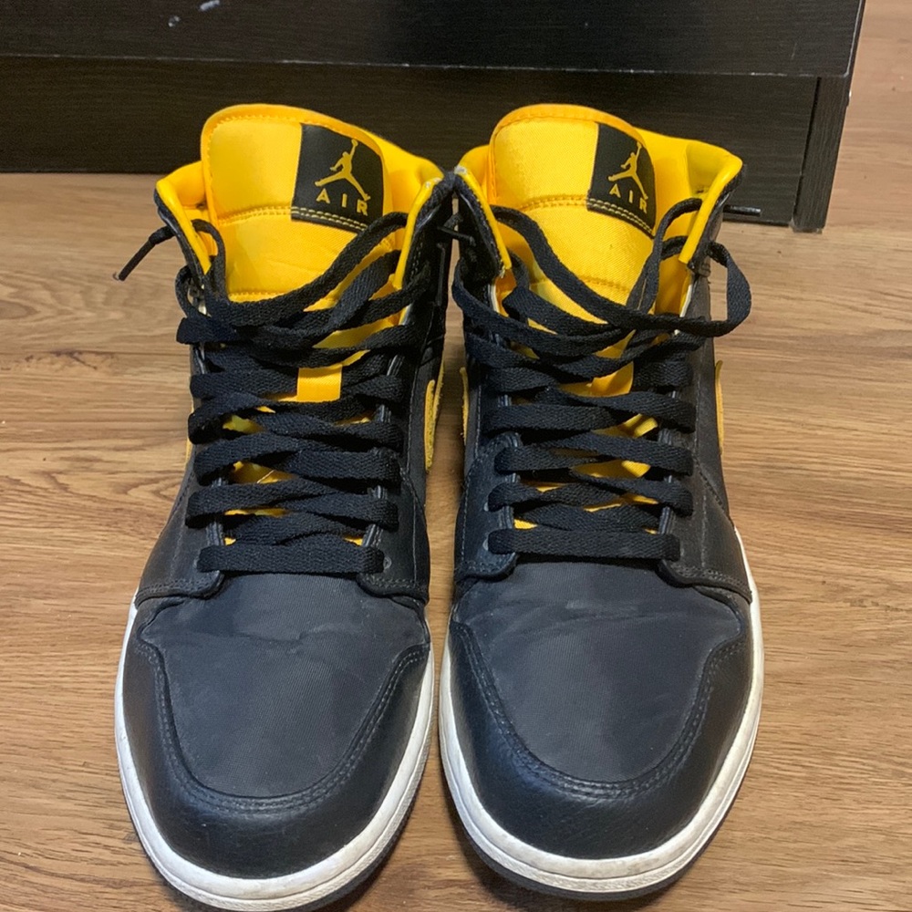 Black and yellow air Jordan 1 high tops